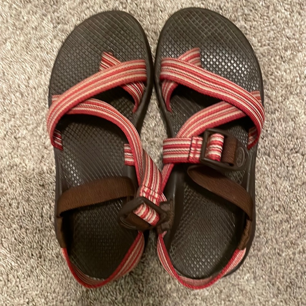 Red, brown, and tan Chacos. Women’s size 7.